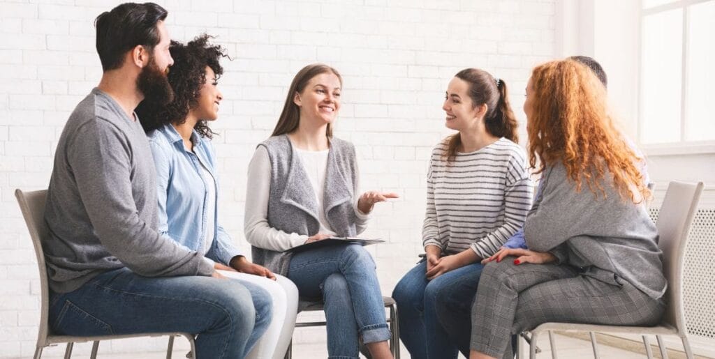 5 people participating in addiction aftercare programs at crest view recovery center.