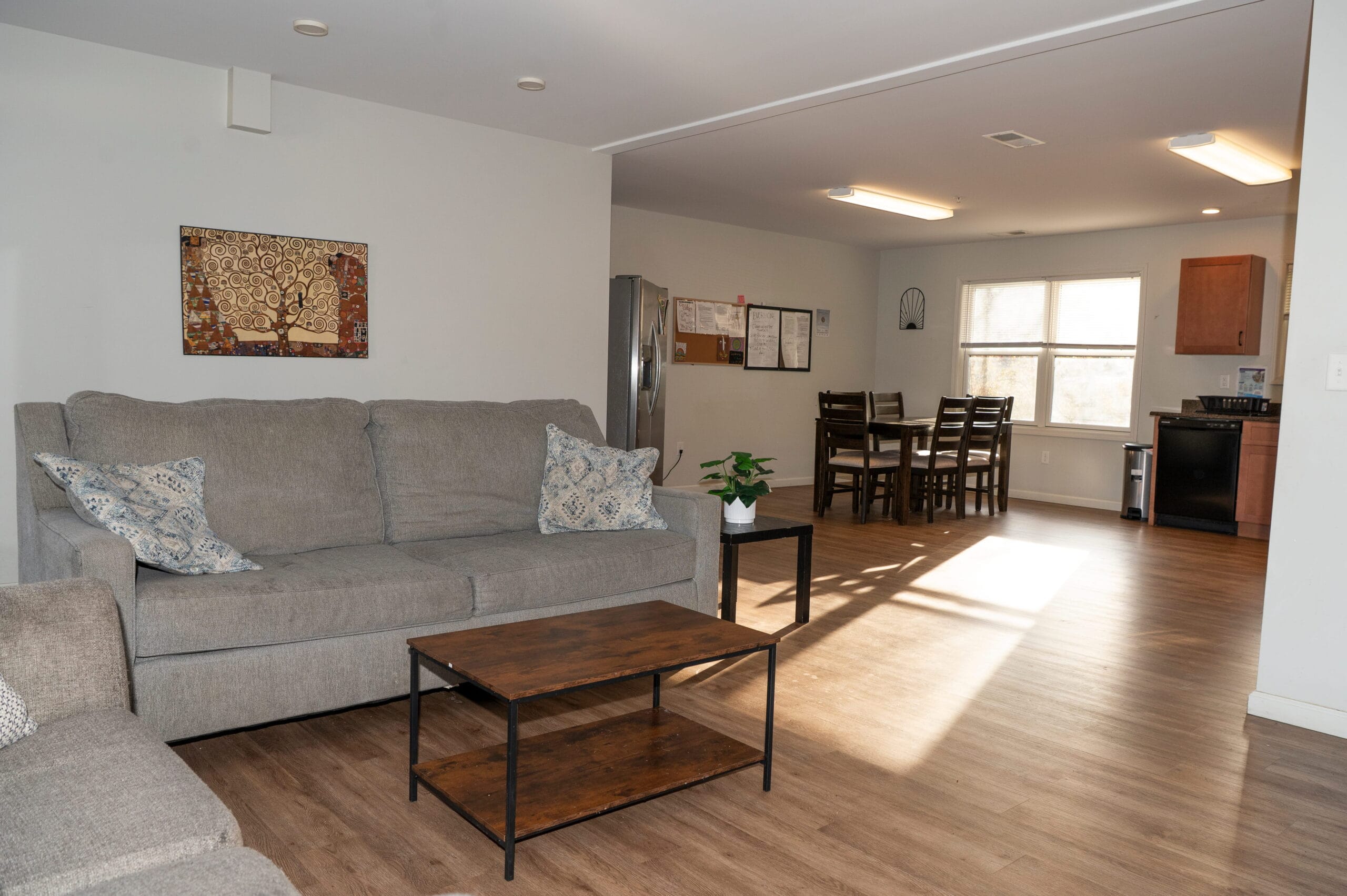 Modern, welcoming outpatient facility in Asheville, NC with cozy lounge, dining area, kitchen—ideal for addiction recovery support.