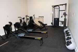 Gym room at Crest View Recovery Center in Asheville, NC with fitness equipment for outpatient addiction treatment and wellness therapy.