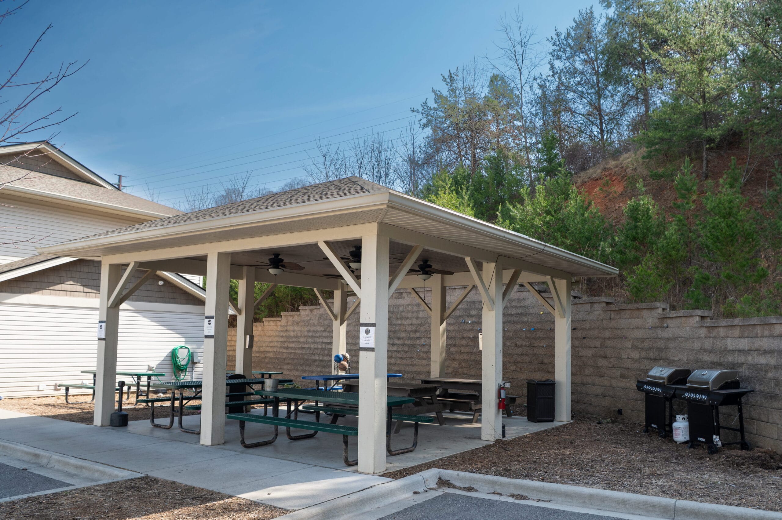 Outdoor pavilion with picnic tables and gas grills near Asheville, ideal for Crest View Recovery Center addiction treatment programs.